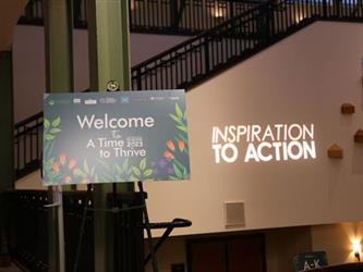 A welcome sign for the Inspiration to Action symposium.