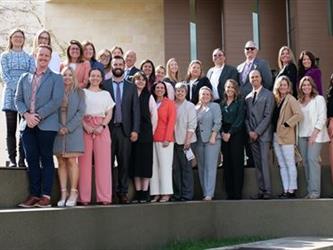 SELPA team members gathered on steps.