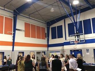 Group of people gathered in a school auditorium